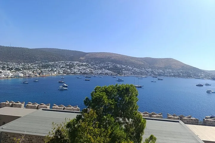 View from Bodrum Castle looking out over the sea filled with boats towards coastal hills